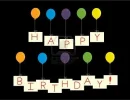 6468280-the-phrase-happy-birthday-on-cards-tied-to-balloons-with-strings-all-on-a-black-backg...webp
