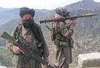 Taliban armed with rocket-propelled grenade launchers patrol outside Swat valley near Buner d...webp