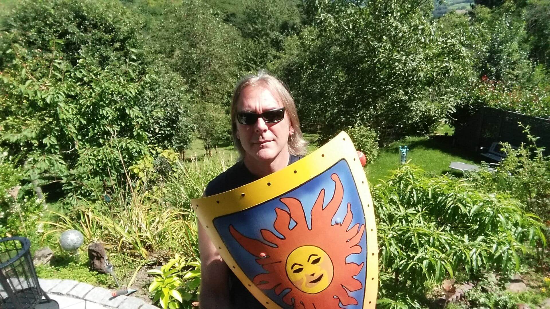 Image of Bryan Bailey Holding A Shield