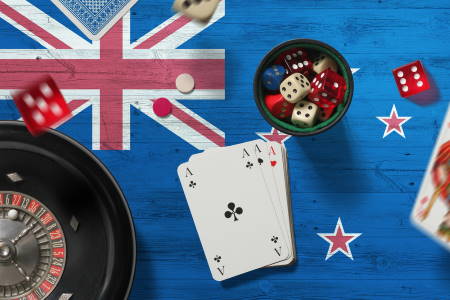 New Zealand casino theme. Aces in poker game, cards and chips on red table with national flag background. Gambling and betting.